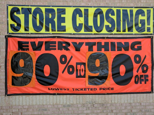 A banner that says, "Store Closing! Everything 90% to 90% off!"